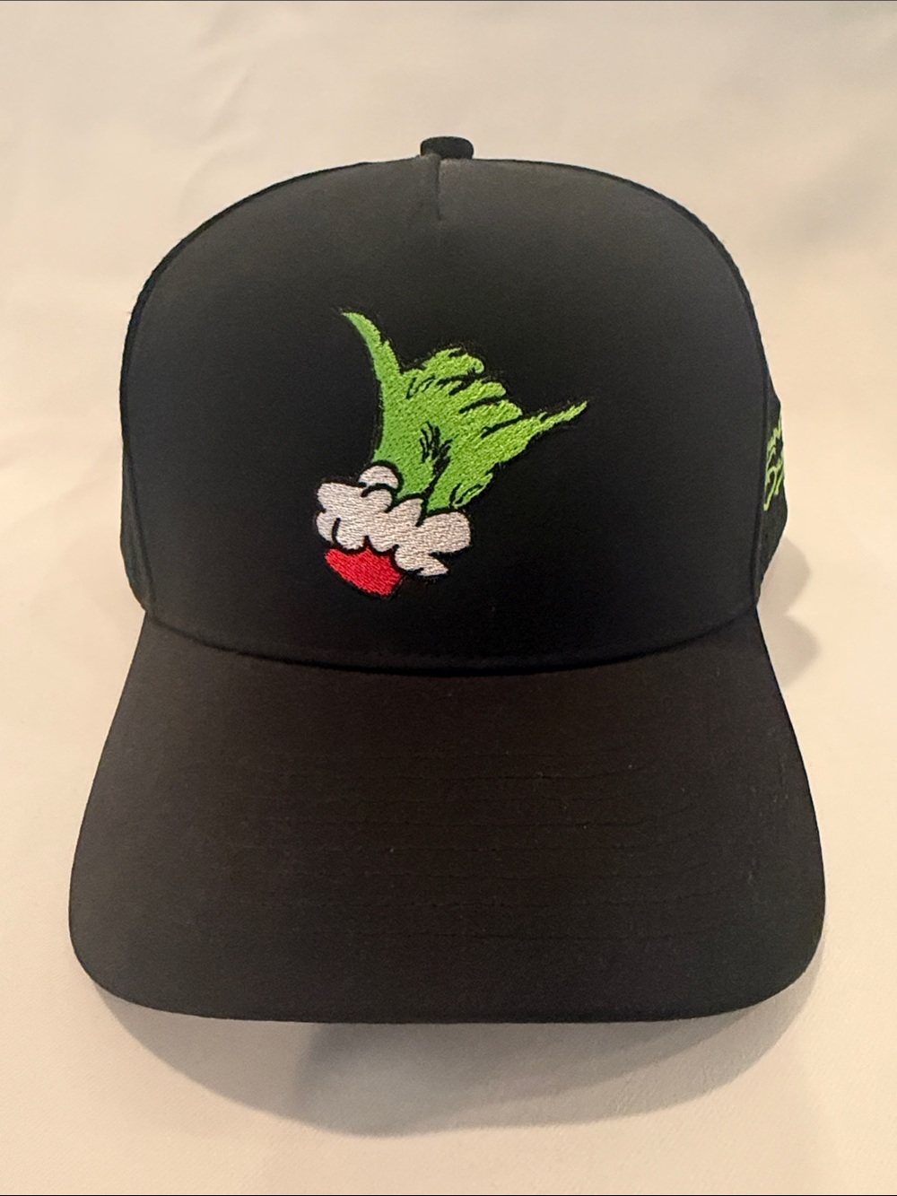 Black Men’s Cap with Green Character Embroidery
